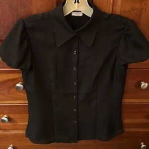Fabulous NWT silky black pleated short sleeved blouse. Pearly buttons.